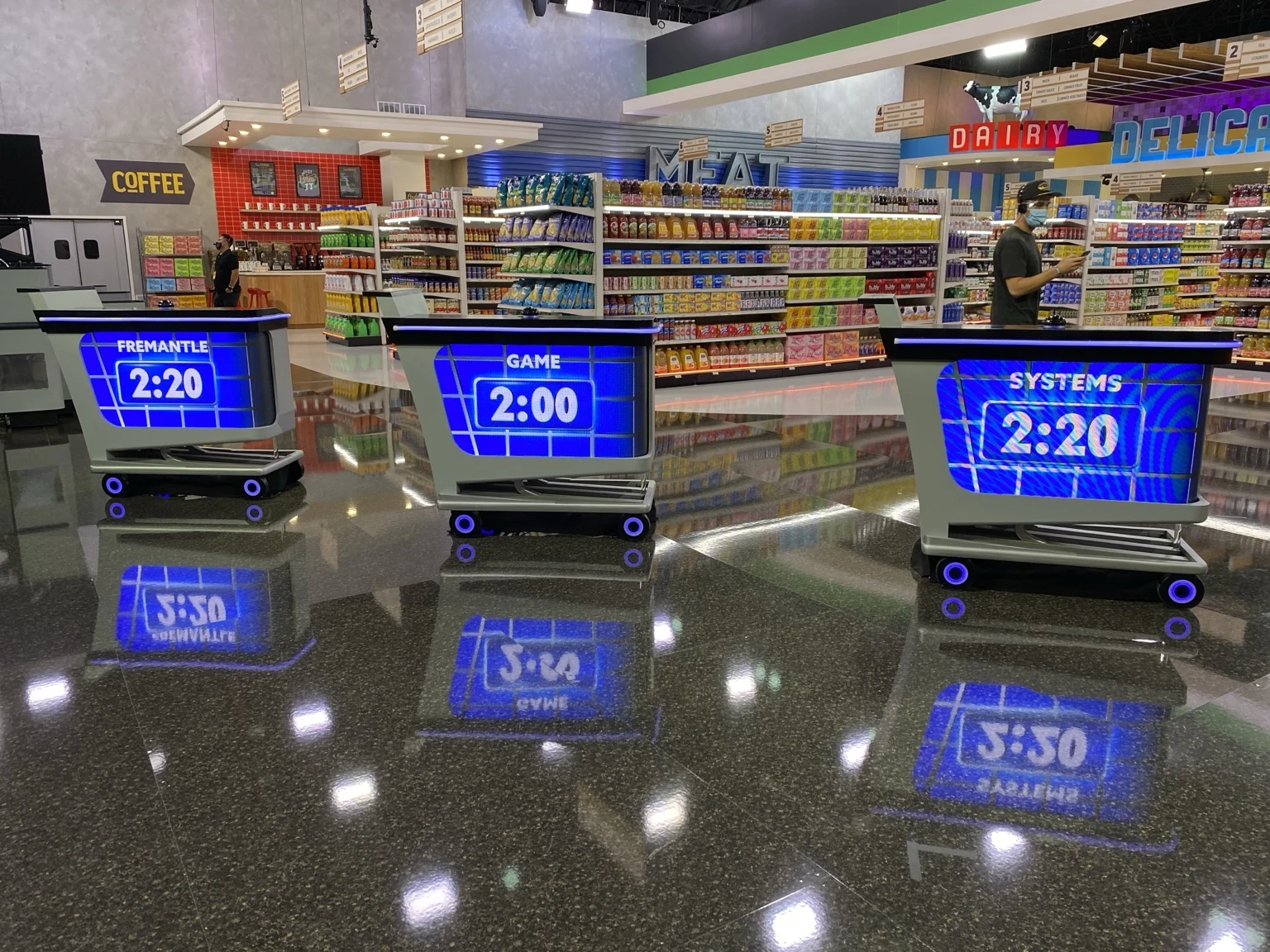 Supermarket Sweep set with illuminated timer carts during technical setup and testing