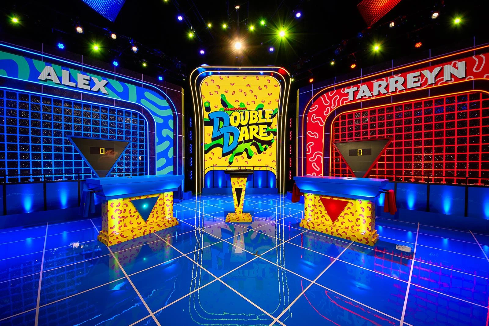 Double Dare production set with red and blue team stations and central logo display
